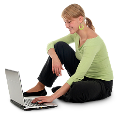 Woman using a laptop on the ground